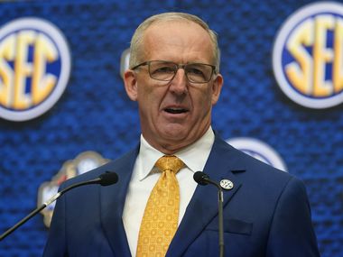 FILE - Southeastern Conference Commissioner Greg Sankey speaks during SEC Media Days, July...