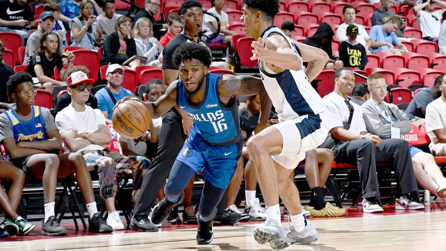 Jordan Walker #16 of the Dallas Mavericks dribbles the ball during the game against the...
