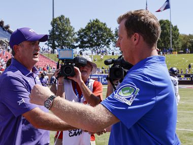 TCU head coach Sonny Dykes (left) greets SMU head coach Rhett Lashlee after a game at Ford...