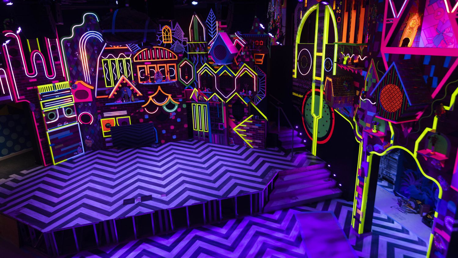 The stage at Meow Wolf Grapevine's "The Real Unreal" glowed with neon colors at Grapevine...