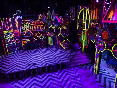 The stage at Meow Wolf Grapevine's "The Real Unreal" glowed with neon colors at Grapevine...
