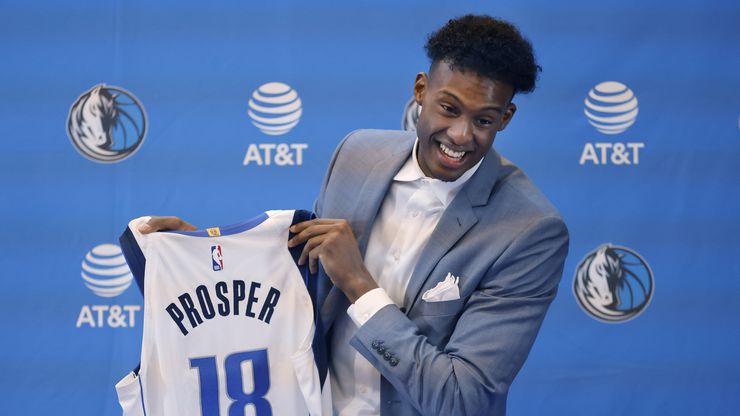 Newly drafted player Olivier-Maxence Prosper of Marquette shows of his new No. 18 jersey...