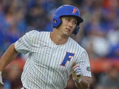 Florida utility Wyatt Langford (36) runs to first base during an NCAA regional championship...