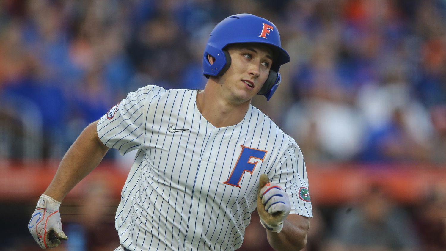 Florida utility Wyatt Langford (36) runs to first base during an NCAA regional championship...